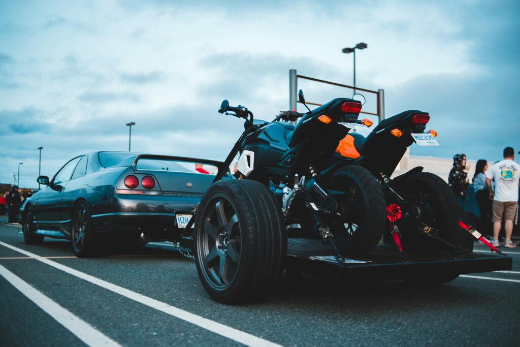 Car towing trailer with motorbikes